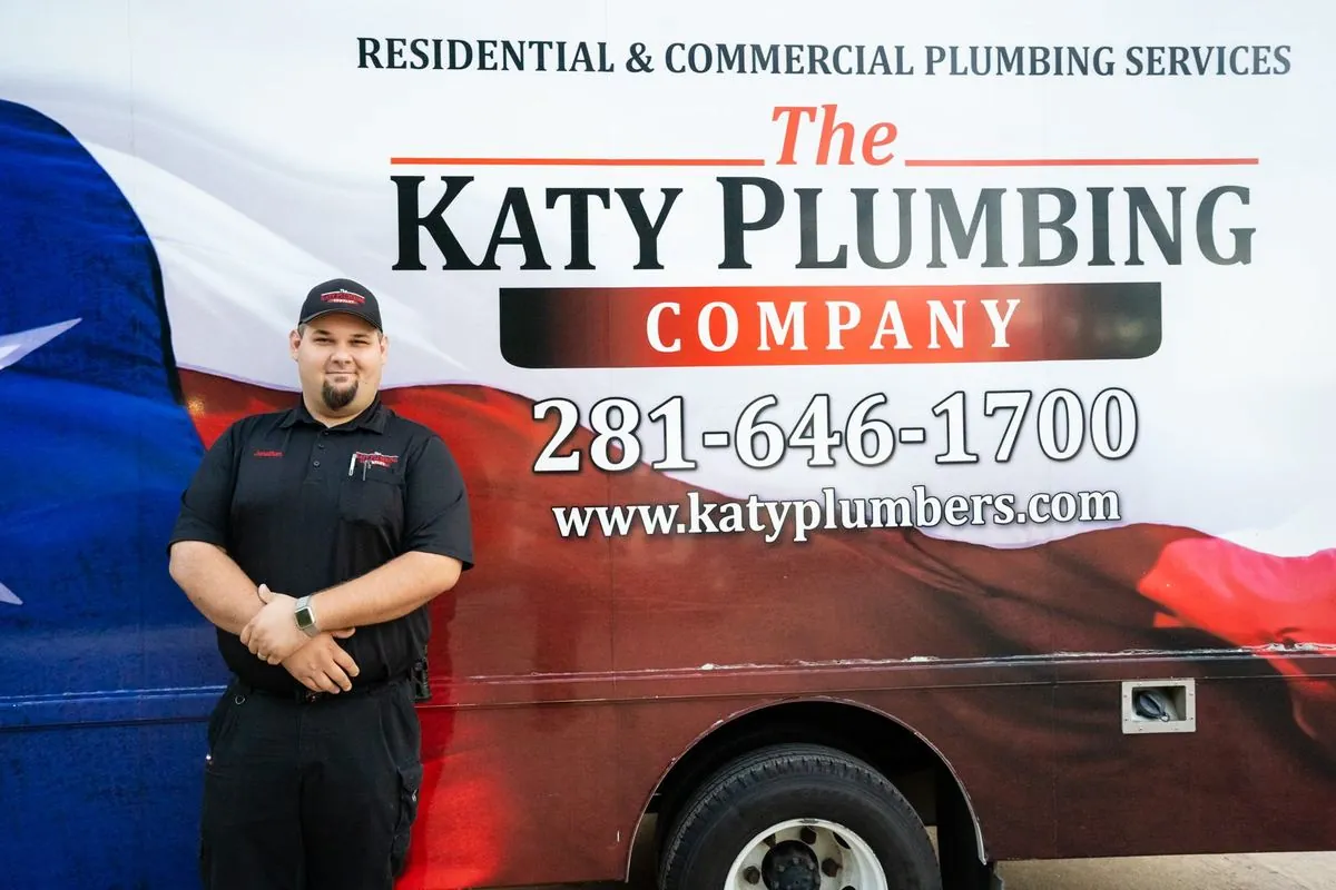 A Katy Plumbing Company technician at a customer's front door